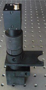 The assembled 3-D printed WBC microscope rests on an optical bench. The holes on the bench are spaced 1 inch apart, giving an idea of the microscope's size. Credit: Alessandra Forcucci, Rice University