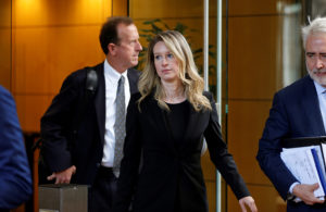 Former Theranos CEO Elizabeth Holmes leaves after a hearing at a federal court in San Jose