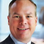 A portrait of Henry Schein executive Dirk Benson