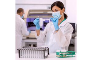 A lab workers uses the BD Max molecular diagnostic system