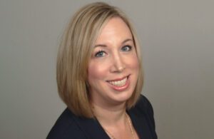 A portrait of Dana Helmink, the senior director of audiology/clinical education at Widex USA