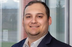 A portrait of Zachary Robbins, a textile process engineer at Cortland Biomedical