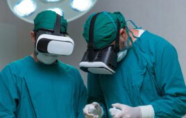 Surgeons wearing virtual reality goggles.