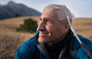 A patient wearing a Novocure Optune device on his head.