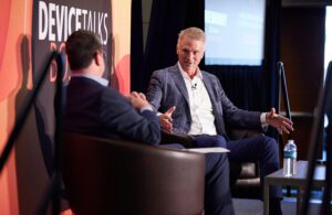 Photo of DeviceTalks Editorial Director Tom Salemi (left) interviewing Boston Scientific CEO Mike Mahoney (right) in front of a crowd of medtech insiders at our DeviceTalks Boston show in early May. 