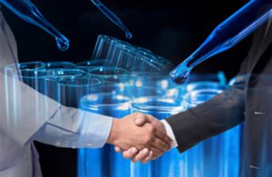 A photo illustration of two people shaking hands in front of medical device lab testing equipment.