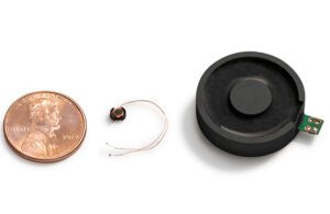 A tiny wireless charging system developed by Resonant Link with a penny for scale.