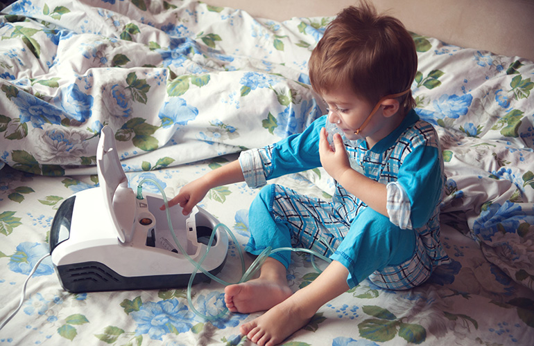 A child using a medical device at home.