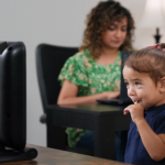 A photo of a child using the EarliTec EarliPoint device for autism diagnosis and assessment.