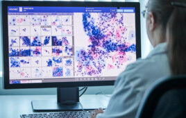 A photo of a cytologist using Hologic's Genius Digital Diagnostics System