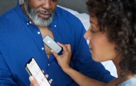 A physician uses an Eko Health Duo digital stethoscope to collect acoustic and ECG data from a patient.