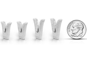 An image showing the Abbott TriClip and MitraClip implants next to a dime.