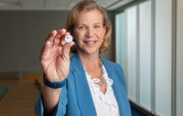 A photo of Abbott Medical Devices President Lisa Earnhardt with a FreeStyle Libre 3 sensor.