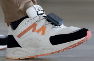 A photo of a Reev Sense sensor attached to a patient's shoe.