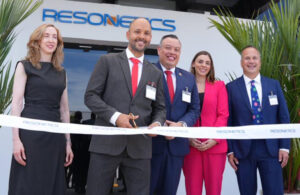 A photo of Resonetics officials at a ribbon-cutting for the opening of their new Costa Rica site.