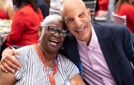 A photo of Mike Mussallem with an Edwards Lifesciences patient on one of the heart valve company's patient days.