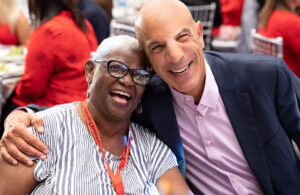 A photo of Mike Mussallem with an Edwards Lifesciences patient on one of the heart valve company's patient days.