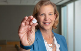 A photo of Abbott Medical Devices President Lisa Earnhardt with a FreeStyle Libre 3 sensor.