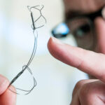 A photo of the Cardiac Dimensions Carillon Mitral Contour System in a physician's hand.