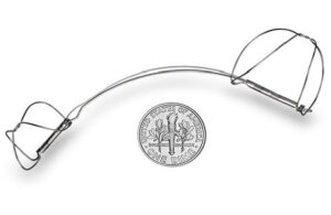 A photo of the The Cardiac Dimensions Carillon Mitral Contour System implant with a dime for scale