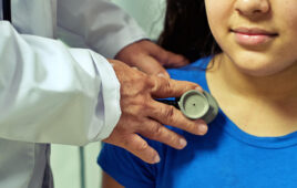 This is a Pixabay image related to pediatrics with a doctor holding a stethoscope to a child's chest. The image could go along with the recent MIT announcement of a pediatric innovation hub.