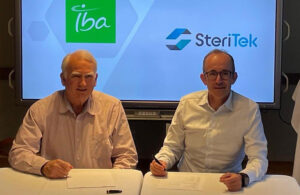 A photo of Steri-Tek CEO Larry Nichols and IBA Deputy CEO Henri de Romrée