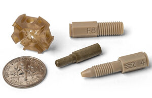 An image of micromolded PEEK components for medical devices.