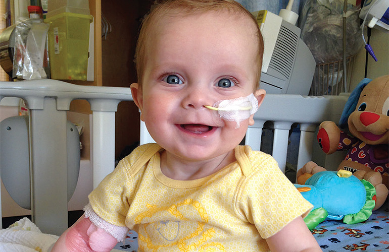 A photo of a baby on a Berlin Heart EXCOR pediatric ventricular assist device (VAD).