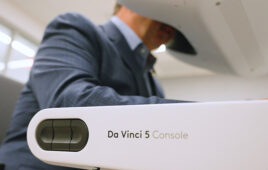 A photo of DeviceTalks Editorial Director Tom Salemi operating an Intuitive Surgical da Vinci 5 in the months leading up to DeviceTalks West.