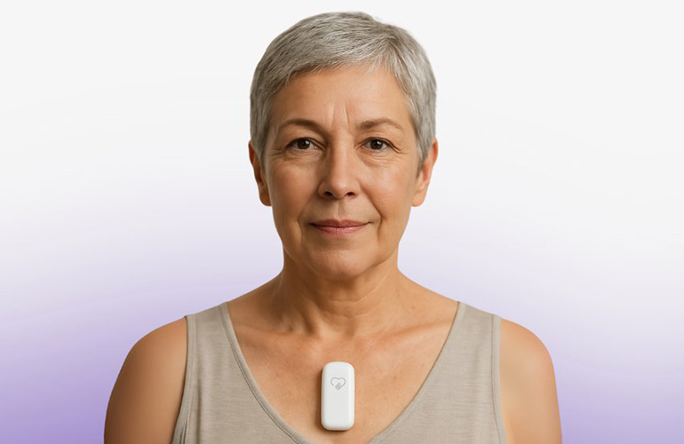 A photo of a patient wearing the Cardiosense CardioTag noninvasive heart monitor.