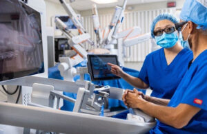 An image of the Medtronic Hugo robotic-assisted surgical system in use.