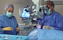 A photo showing an eye surgeon using BVI's R-Evo Smart phaco machine in an operating room.