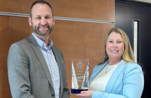 A photo of Fort Wayne Metals President Jeremy Rohrs and Chief Commercial Officer Kimberly Shoppell posing with their 2025 Supplier Innovation Excellence Award from Medtronic.
