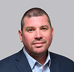 This is a portrait photo of Igor Drugov, a technical fellow at Resonetics’ LightSpeed ADL.