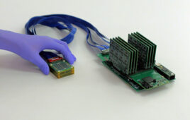 An image of a small portable ultrasound system with a probe and processing module.