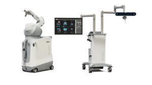 An image of a robotic arm system and separate guidance system with a TV.