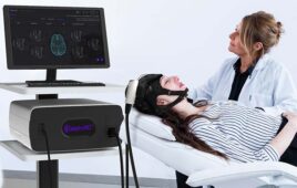 An image of the QuantalX Neuroscience Delphi-MD system being used on a patient.