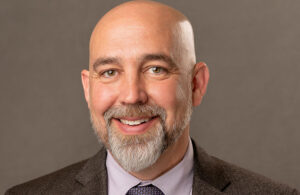 A headshot of Synergy Spine CEO Josh Butters