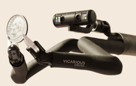 Vicarious Surgical's robot holding a dime.
