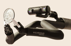 Vicarious Surgical's robot holding a dime.