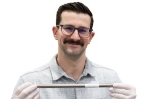 A photo of Aptyx R&D Engineer Matt Navarro with ePTFE-covered nitinol.