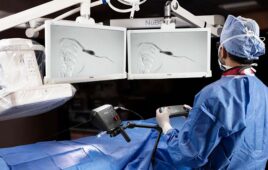A photo of a surgeon using Microbot Medical's Liberty endovascular robotic system.