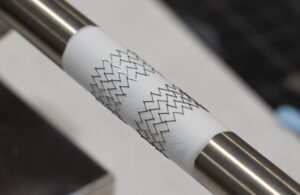 A photo of nitinol and ePTFE on a mandrel.