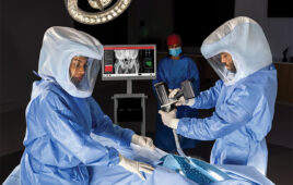 A photo of ortho surgeons using J&J MedTech's DePuy Synthes Velys Hub in the operating room.