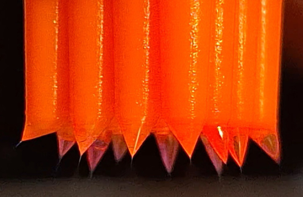 A photo offering a closer look at the nozzles that emit the three-layered microdroplets.