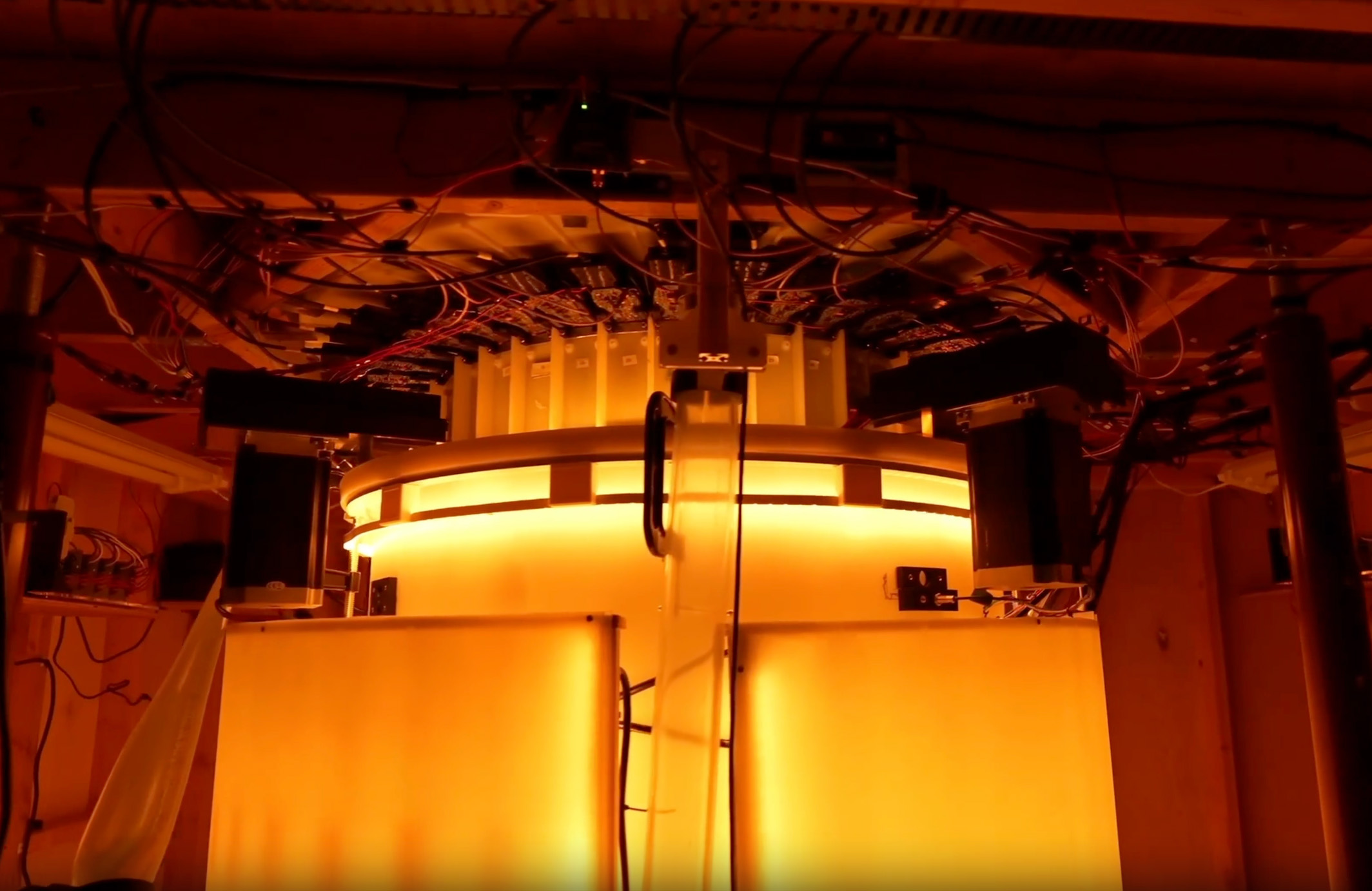 A still from Midjourney's promotional video depicting the scanner tank that a person would be lowered into for ultrasonic CT imaging.