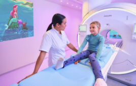 A photo of a child preparing to get an MRI scan.