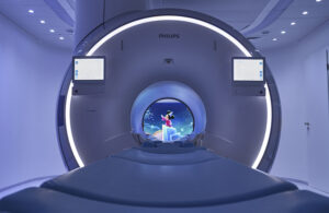 This is a Philips marketing image showing Disney's Mickey Mouse inside an MRI as part of Philips Ambient Experience.