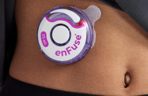 A photo of the Enable Injections Enfuse on-body injector worn on a patient's stomach.