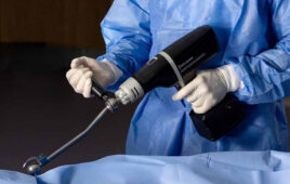A photo of a surgeon using the Johnson & Johnson MedTech DePuy Synthes Kincise Surgical Automated System.